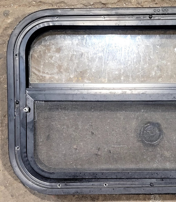 Used Black Radius Opening Window : 23 1/2" W x 14 1/2" H x 1 3/4" D - Young Farts RV Parts