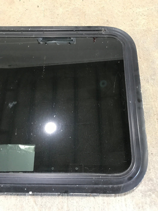 Used Black Radius Emergency Opening Window : 29 1/2" W x 21 1/2" H x 1 7/8" - Young Farts RV Parts