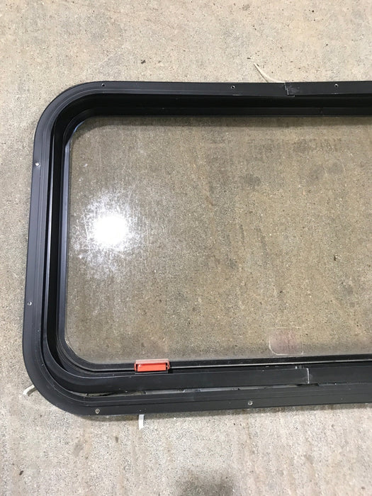 Used Black Radius Emergency Opening Window : 30 1/2" W x 19 1/4" H x 1 1/4" - Young Farts RV Parts