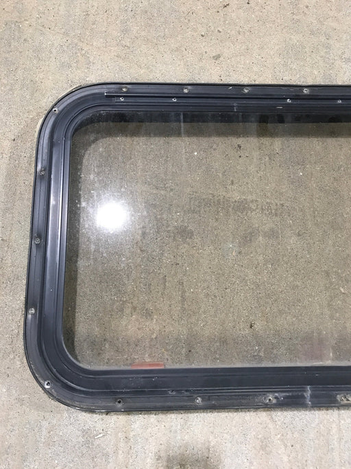 Used Black Radius Emergency Opening Window : 30 1/2" W x 19 1/4" H x 1 1/4" - Young Farts RV Parts