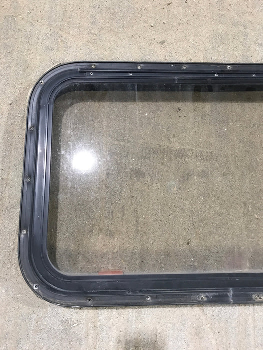 Used Black Radius Emergency Opening Window : 30 1/2" W x 19 1/4" H x 1 1/4" - Young Farts RV Parts