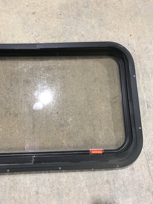 Used Black Radius Emergency Opening Window : 30 1/2" W x 19 1/4" H x 1 1/4" - Young Farts RV Parts