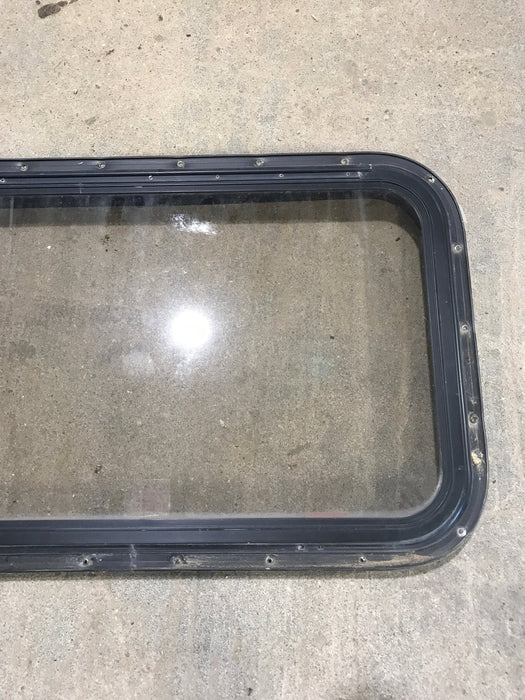 Used Black Radius Emergency Opening Window : 30 1/2" W x 19 1/4" H x 1 1/4" - Young Farts RV Parts