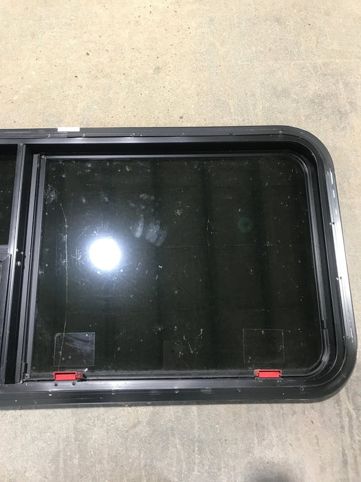 Used Black Radius Emergency Opening Window : 41 1/2" W x 21 1/2" H x 1 7/8" - Young Farts RV Parts
