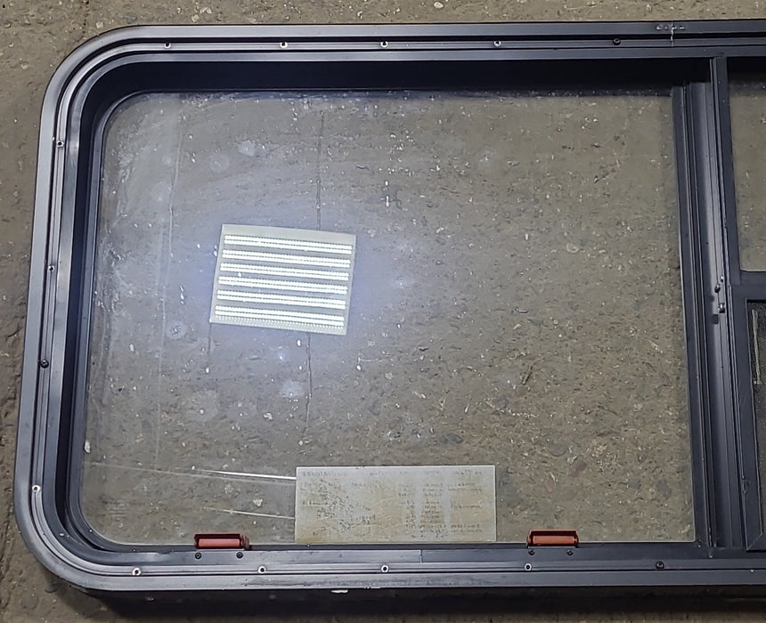 Used Black Radius Emergency Opening Window : 47 1/2" W x 21 1/4" H x 1 7/8" D - Young Farts RV Parts