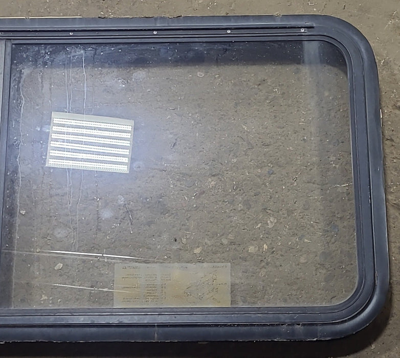 Used Black Radius Emergency Opening Window : 47 1/2" W x 21 1/4" H x 1 7/8" D - Young Farts RV Parts