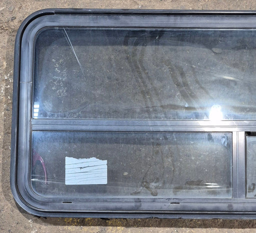 Used Black Radius Emergency Opening Window : 47 1/4" W x 21 1/4" H x 1 3/4" D - Young Farts RV Parts