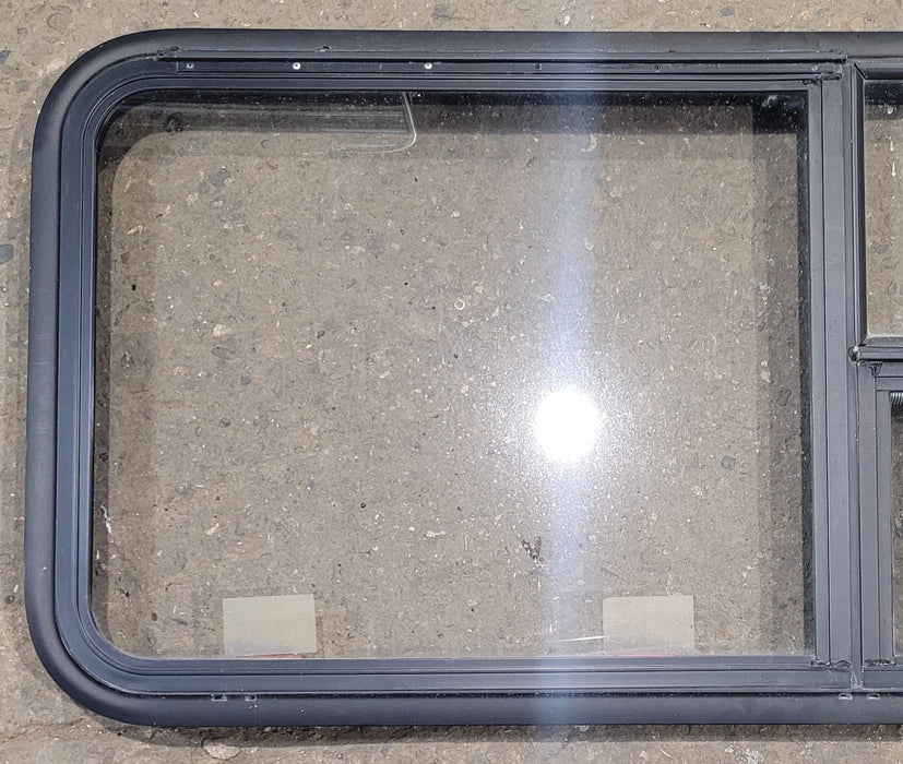 Used Black Radius Emergency Opening Window : 47 1/4" W x 21 1/4" H x 1 7/8" - Young Farts RV Parts