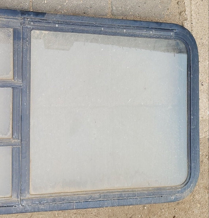 Used Black Radius Emergency Opening Window : 48 x 23 x 2" D - Young Farts RV Parts