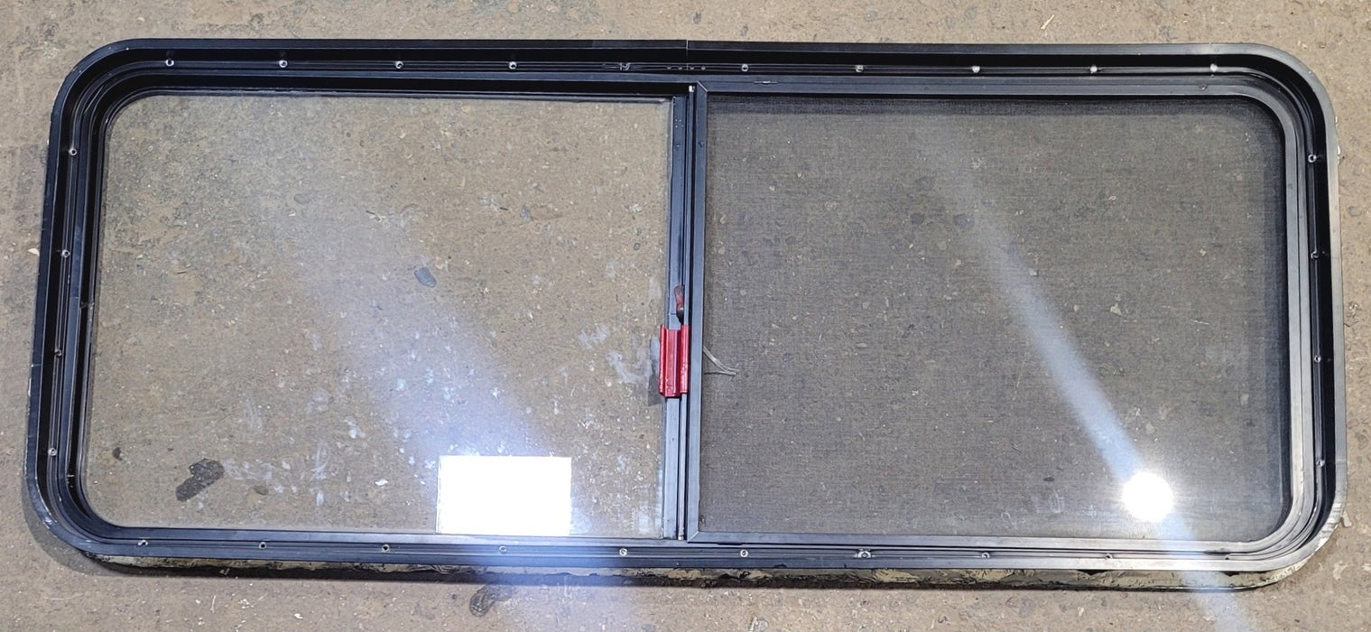 Used Black Radius Emergency Opening Window : 54 1/4" W x 21 3/4" H x 1 3/4" - Young Farts RV Parts