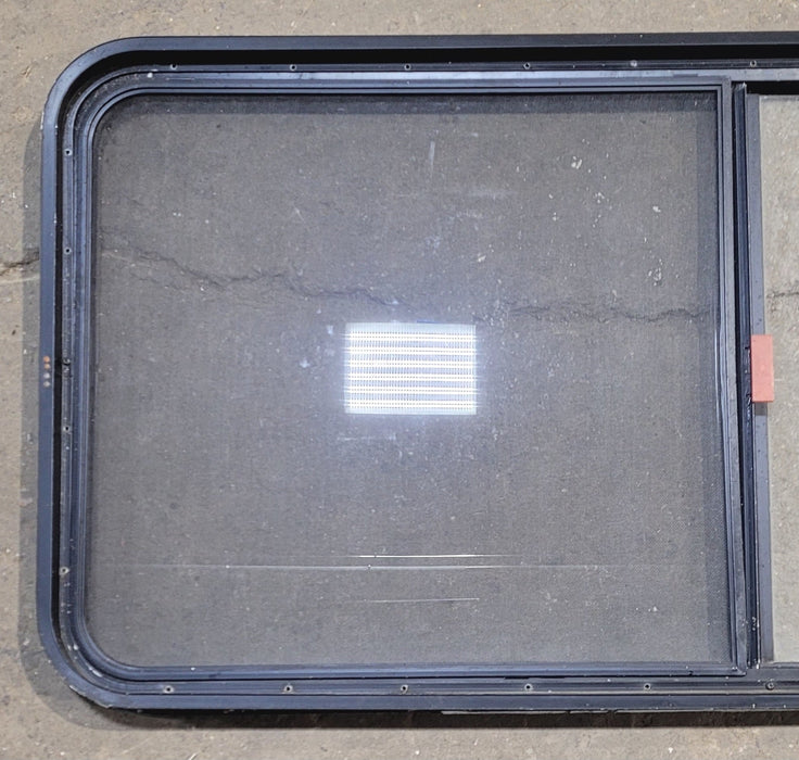 Used Black Radius Emergency Opening Window : 55 1/4" W x 25 1/2" H x 1 7/8" - Young Farts RV Parts