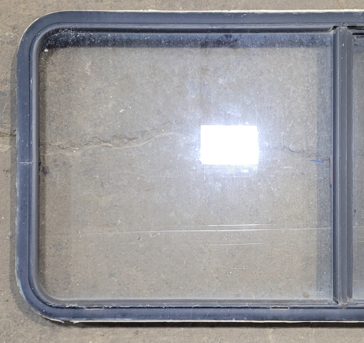 Used Black Radius Emergency Opening Window : 55 1/4" W x 25 1/2" H x 1 7/8" - Young Farts RV Parts