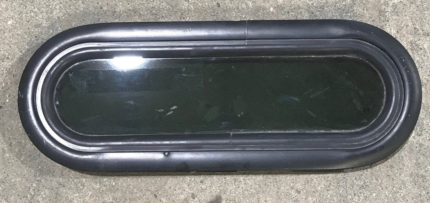 Used Black Radius Non Opening Window : 14 1/2" W X 4 1/2" H X 3/4" D - Young Farts RV Parts