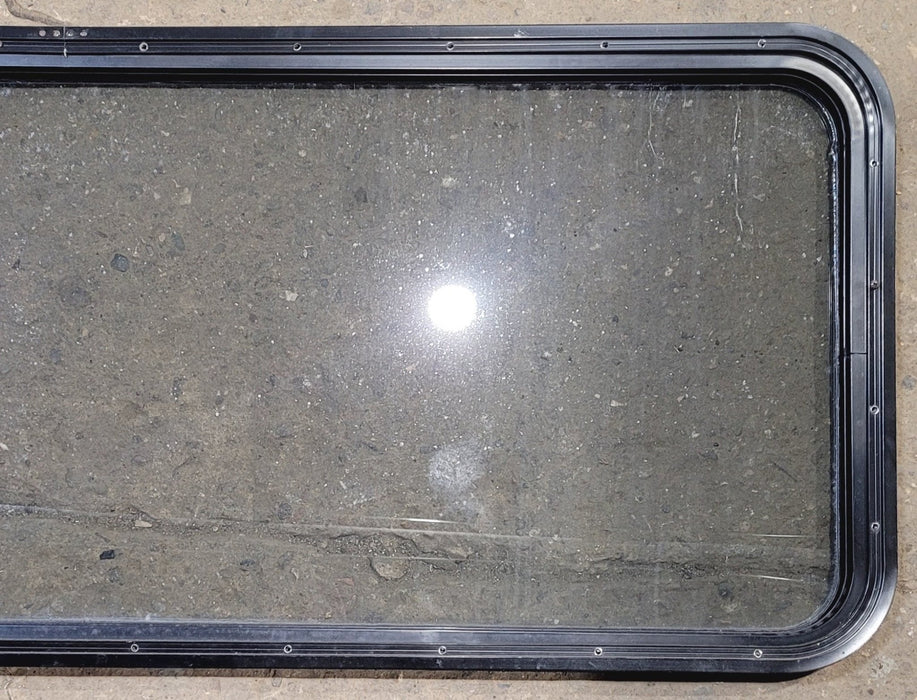 Used Black Radius Non Opening Window : 57 1/2" W x 21 1/2" H x 1 1/4" - Young Farts RV Parts