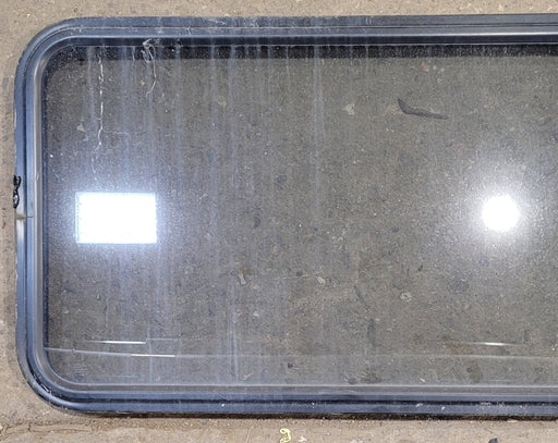 Used Black Radius Non Opening Window : 57 1/2" W x 21 1/2" H x 1 1/4" - Young Farts RV Parts