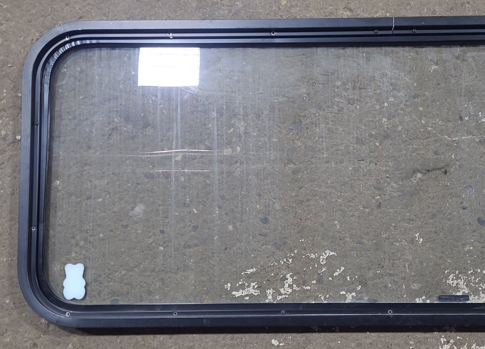 Used Black Radius Non Opening Window : 59 3/4" W x 21 1/2" H x 1 1/2" D - Young Farts RV Parts