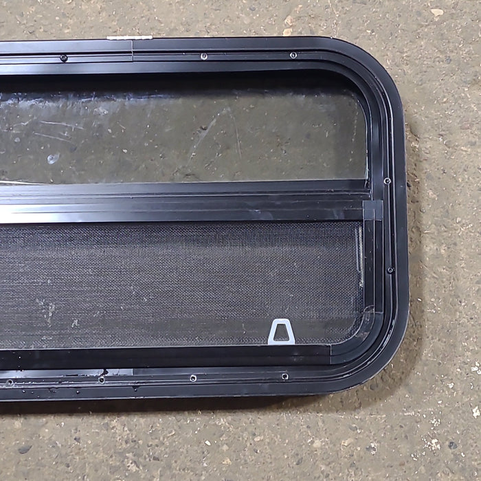 Used Black Radius Opening Window : 23 1/2" W x 14 1/2" H x 1 3/4" D - Young Farts RV Parts