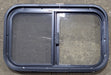 Used Black Radius Opening Window : 23 1/2" W x 14 1/2" H x 1 7/8" D - Young Farts RV Parts