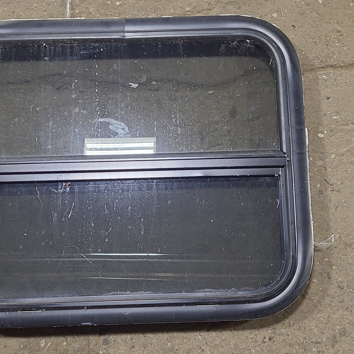 Used Black Radius Opening Window : 23 1/2" W x 19 1/2" H x 1 3/4" D - Young Farts RV Parts