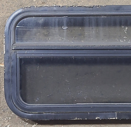 Used Black Radius Opening Window : 23 1/4" W x 14 1/4" H x 1 7/8" D - Young Farts RV Parts