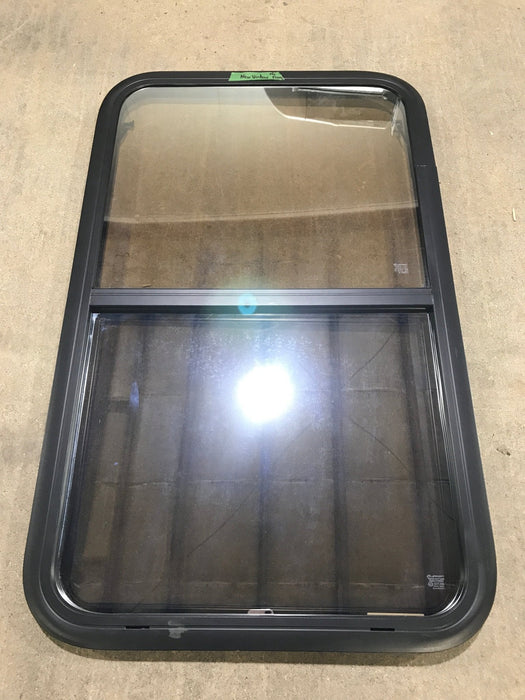 Used Black Radius Opening Window : 23 3/4" W x 39 3/4" H x 1 1/2" D - Young Farts RV Parts