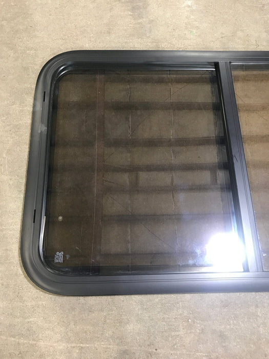 Used Black Radius Opening Window : 23 3/4" W x 39 3/4" H x 1 1/2" D - Young Farts RV Parts