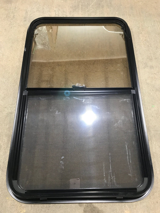Used Black Radius Opening Window : 23 3/4" W x 39 3/4" H x 1 1/2" D - Young Farts RV Parts
