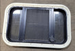 Used Black Radius Opening Window : 23" X 14 1/4" X 1 3/4" D - Young Farts RV Parts