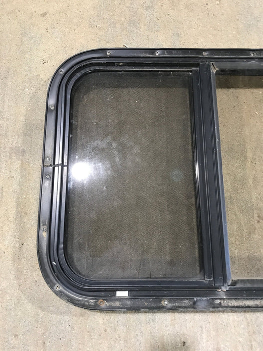Used Black Radius Opening Window : 24 1/2" W x 19 1/4" H x 1 1/4" - Young Farts RV Parts