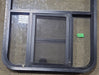 Used Black Radius Opening Window : 24 1/2" W x 41 3/4" H x 1 5/8" D - Young Farts RV Parts