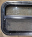 Used Black Radius Opening Window : 24 1/4" W x 14 1/4" H x 1 7/8" - Young Farts RV Parts