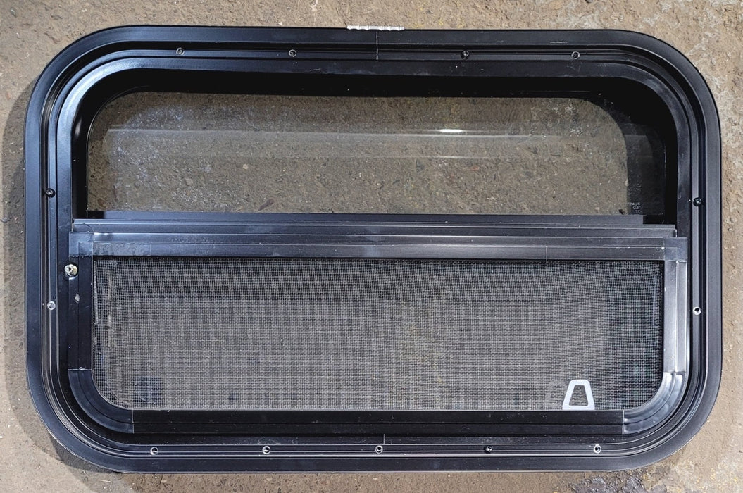 Used Black Radius Opening Window : 24 1/4" W x 14 1/4" H x 1 7/8" - Young Farts RV Parts