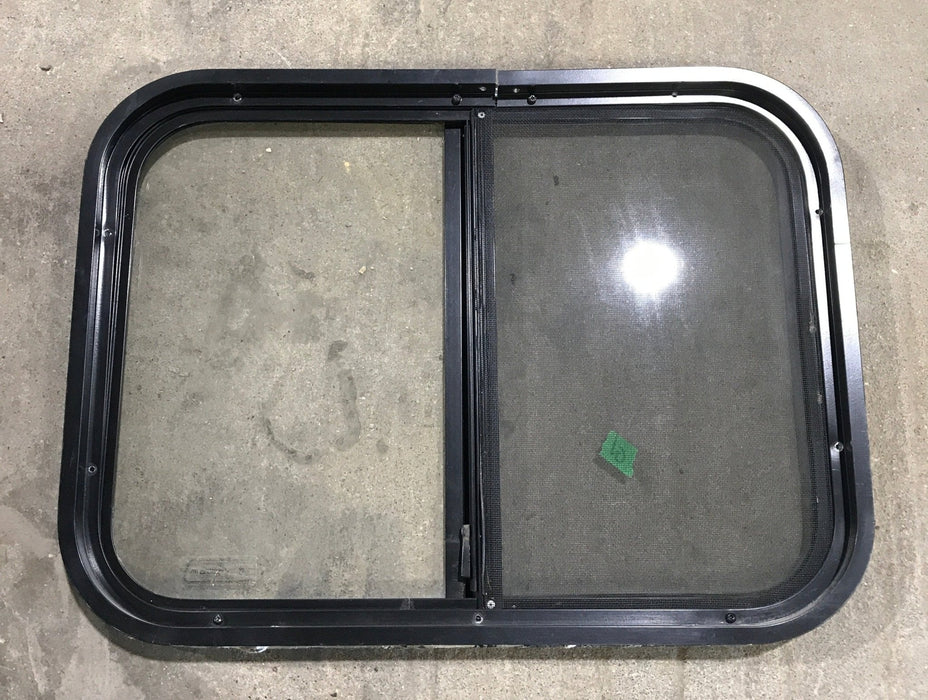 Used Black Radius Opening Window : 24 1/4" W x 17 3/4" H x 1 1/4" - Young Farts RV Parts
