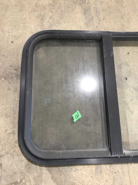 Used Black Radius Opening Window : 24 1/4" W x 17 3/4" H x 1 1/4" - Young Farts RV Parts