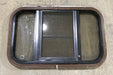 Used Black Radius Opening Window : 24 3/4" W x 15 3/4" H x 1 1/2" D - Young Farts RV Parts