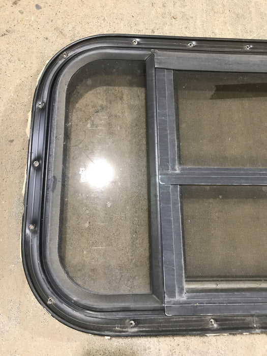 Used Black Radius Opening Window : 24 3/4" W x 15 3/4" H x 1 1/2" D - Young Farts RV Parts