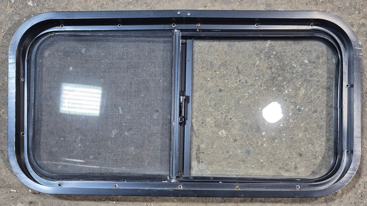 Used Black Radius Opening Window : 29 1/2" W x 14 3/4" H x 1 7/8" - Young Farts RV Parts