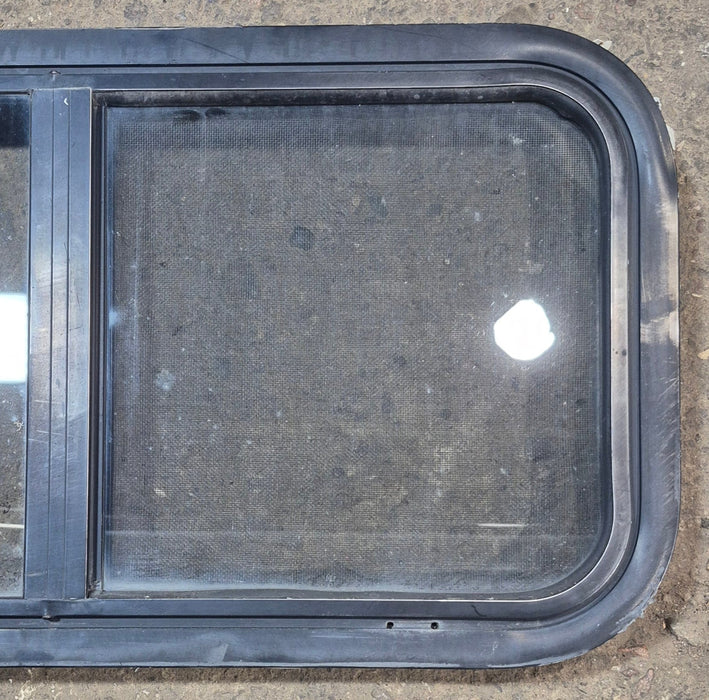 Used Black Radius Opening Window : 29 1/2" W x 14 3/4" H x 1 7/8" - Young Farts RV Parts