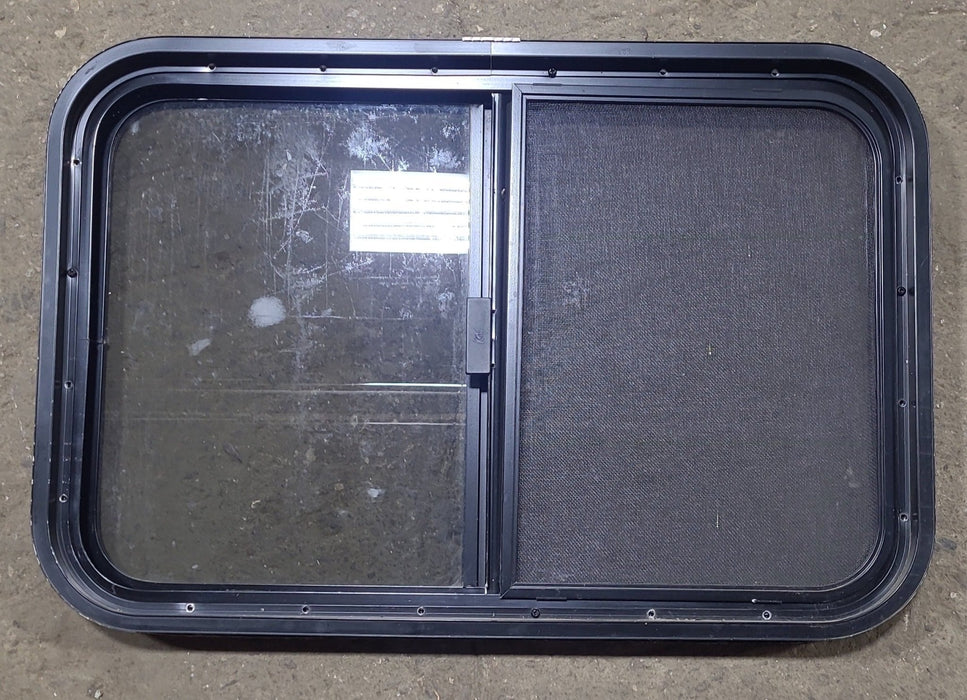 Used Black Radius Opening Window : 29 1/2" W x 19 1/2" H x 1 3/4" D - Young Farts RV Parts