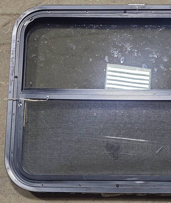 Used Black Radius Opening Window : 29 1/4" W x 21 1/2" H x 1 7/8" D - Young Farts RV Parts