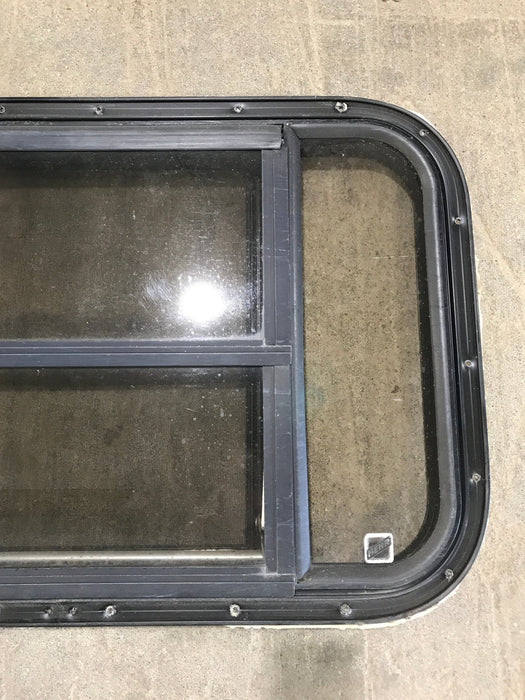 Used Black Radius Opening Window : 30 1/2" W x 18 3/4" H x 1 1/2" D - Young Farts RV Parts