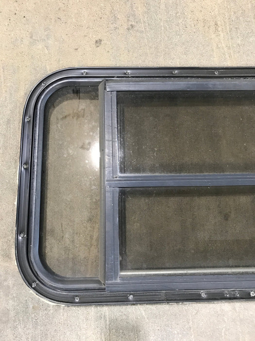 Used Black Radius Opening Window : 30 1/2" W x 18 3/4" H x 1 1/2" D - Young Farts RV Parts