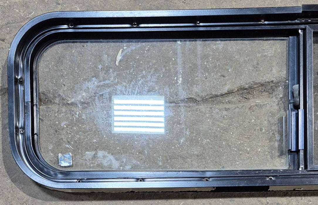 Used Black Radius Opening Window : 42 1/4" W x 11 3/4" H x 1 7/8" - Young Farts RV Parts