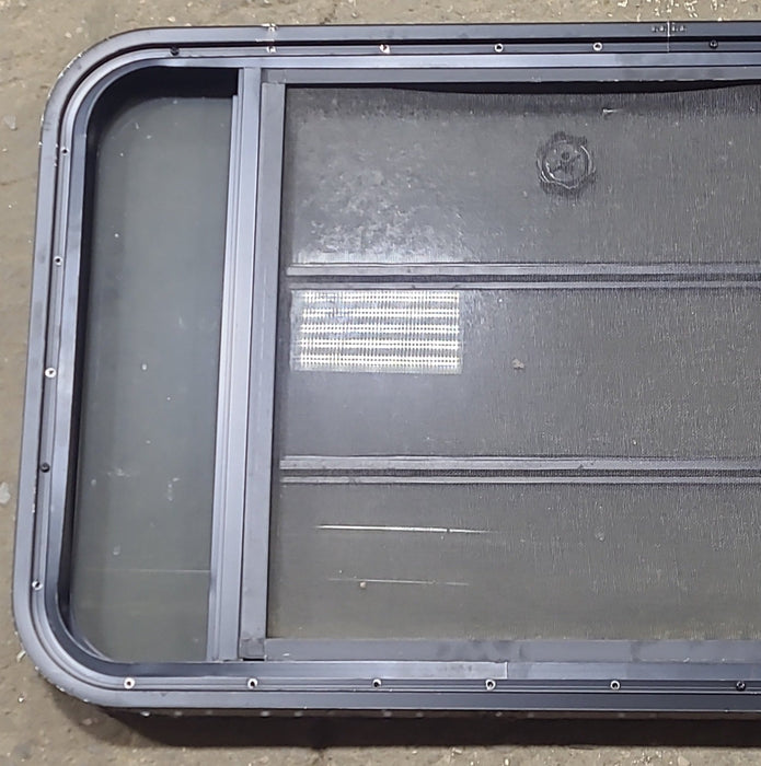 Used Black Radius Opening Window : 45 3/8" W x 22 1/2" H x 1 3/4" D - Young Farts RV Parts