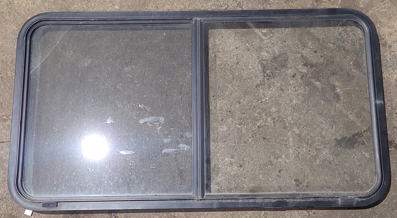 Used Black Radius Opening Window : 48 1/2" W x 26" H x 1 3/4" D - Young Farts RV Parts