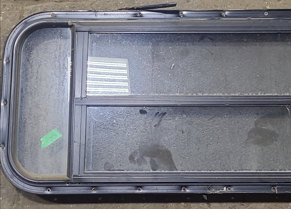 Used Black Radius Opening Window : 48 3/4" W x 16 1/2" H x 1 5/8" D - Young Farts RV Parts