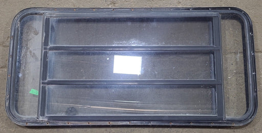 Used Black Radius Opening Window : 48 3/4" W x 23 1/2" H x 1 5/8" D - Young Farts RV Parts