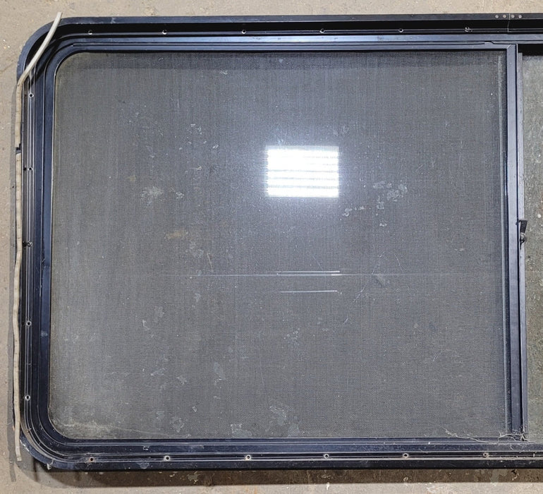 Used Black Radius Opening Window : 64 1/4" W x 28 3/4" H x 1 3/4" - Young Farts RV Parts