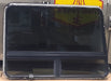 Used Curved Frameless Black Radius Opening Window : 41" X 27 1/4" X 1 1/4" D - Young Farts RV Parts