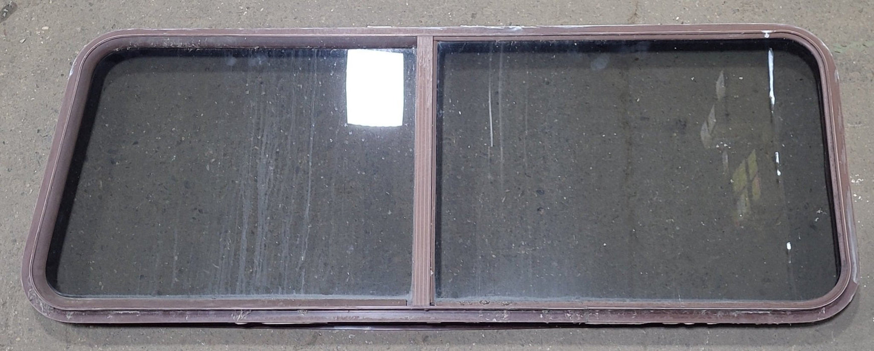 Used Slanted Brown Radius Opening Window : 22 1/8" H X 58 3/4" W  X 2" D
